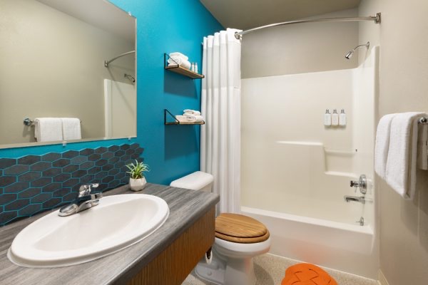Renovated guest bathroom with blue tile