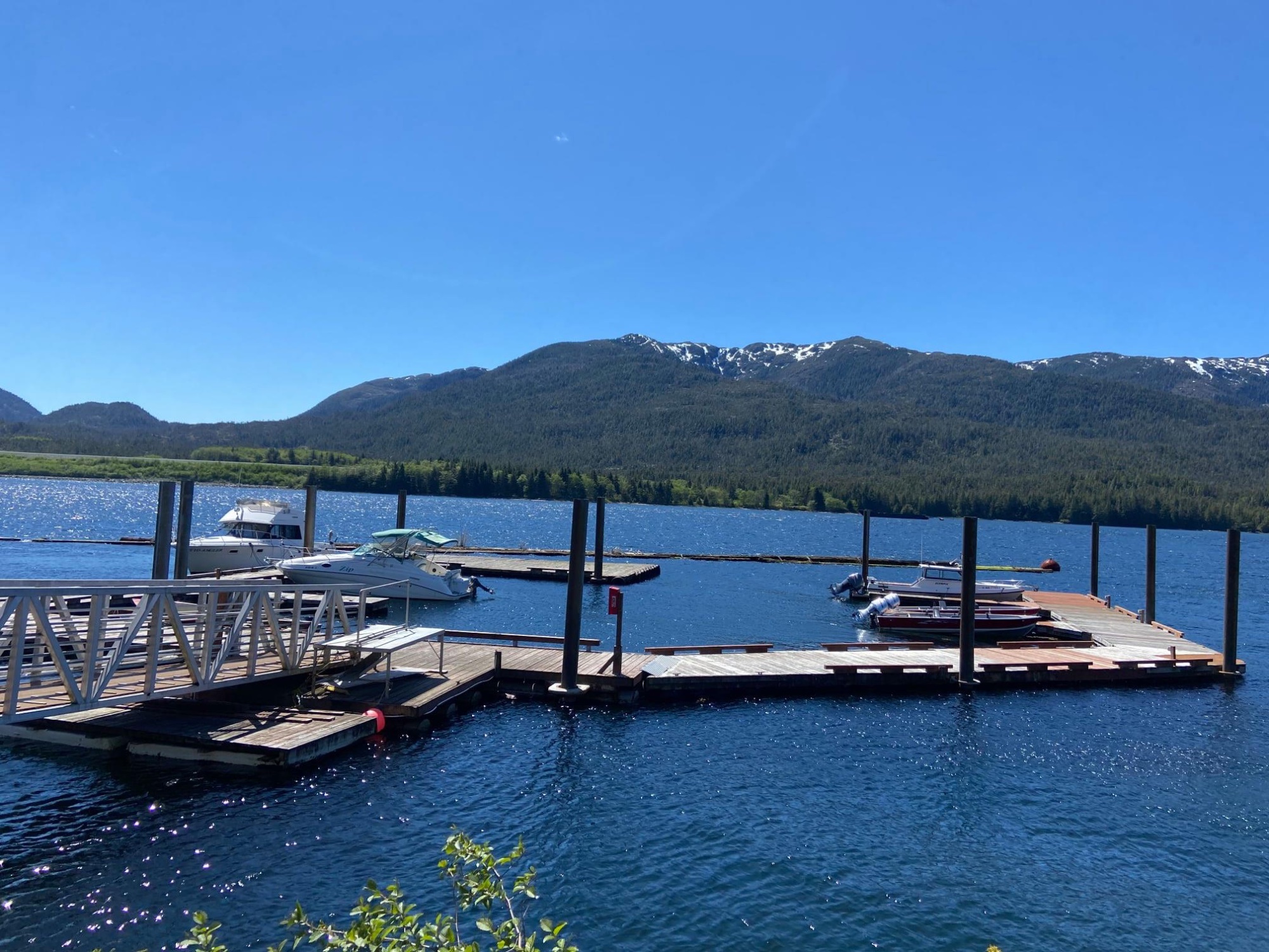 Marina on a sunny summer day with mountains